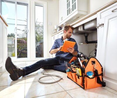 Expert plumber fixing a leaking pipe | Plumbing Repairs in London